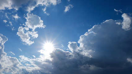 Fototapeta na wymiar clear weather sky, sun on blue sky with clouds, sun rays