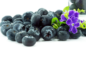 Blueberries with leaves on white background