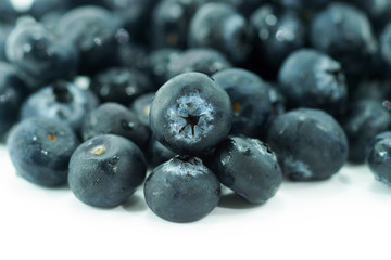 Blueberries with leaves on white background