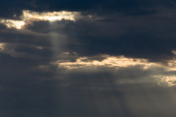 ray light of sun through cloud