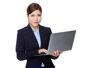 Asian Young Businesswoman use of the laptop computer