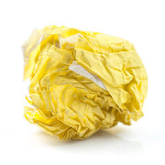 yellow ball crumpled paper on a white background