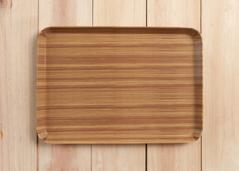 square wood tray on table wood, top view