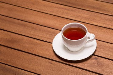 A cup of tea on the wooden table
