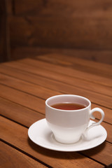 A cup of tea on the wooden table