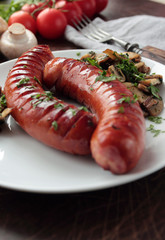 Grilled sausages with fresh mushrooms and parsley