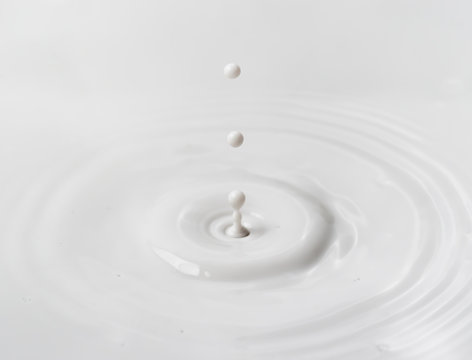 milk drop or white liquid drop created ripple wave