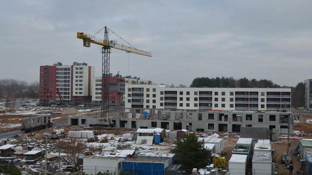 One year timelapse time lapse of construction site industrial works. Workers with cranes building block flat apartment house district. Static shot. 4K