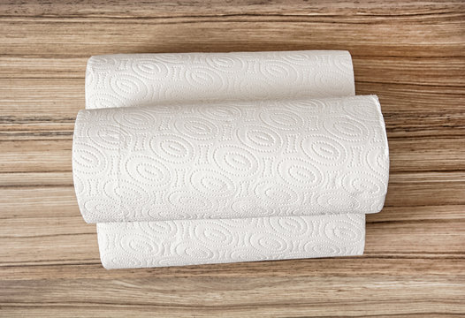Toilet paper on the wooden background, hygiene theme