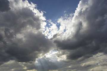 Two clouds hid  sun in the sky