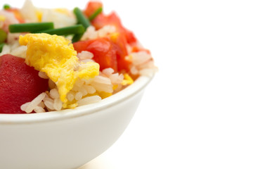 close up of homemade fried rice with tomatoes and egg with clipping path and copy space