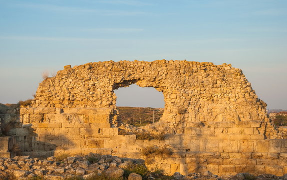 Ruins of ancient city Chersonesus in Crimea at sunset