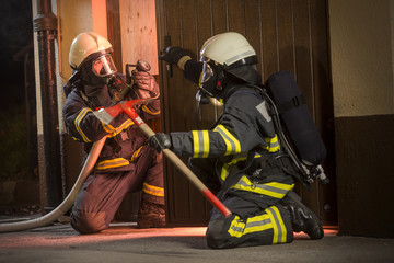 Firefighters in action battling the flames