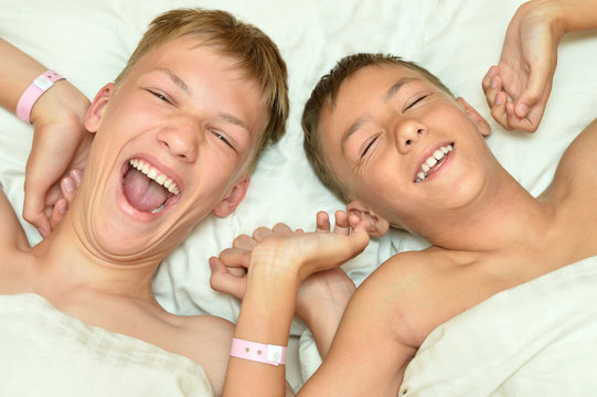 Two brothers waking up