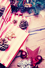 ..Christmas background with decorations and gift boxes on wooden