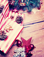 ..Christmas background with decorations and gift boxes on wooden