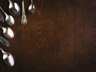 Silver spoons in corner