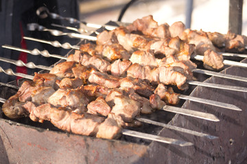 chef grilling lamb ribs on flame