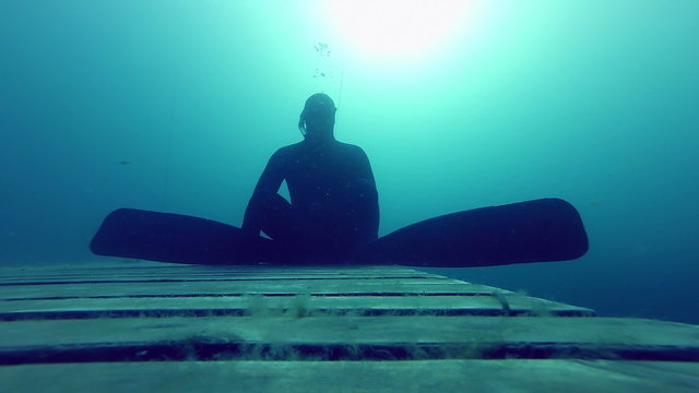 Zen and very Calm and Relax, a Freediver is Doing a Static at 10m Deep for more than a minute.