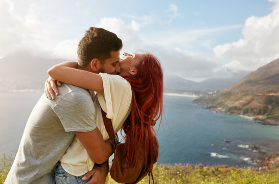 Loving young couple embracing outdoors