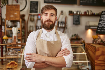 Portrait of confident cafe owner