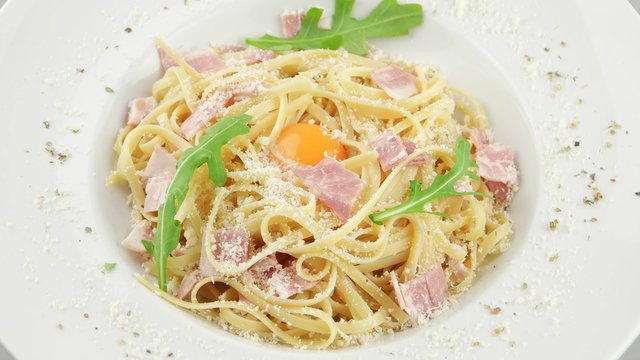 Italian pasta Carbonara with parmesan, yolk and bacon
