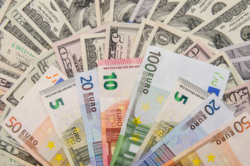 Fototapeta na wymiar Banknotes of euros above dollars