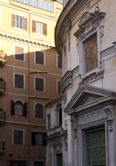 Fototapeta na wymiar Close up of the entrance of San Bernardo alle Terme church in Rome, with the surroundings buildings in Rome