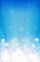 Winter blurred background with snowflakes, sparkles and rays