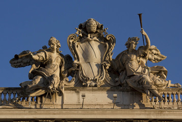Close up detail of the statue on the top of Palazzo della Consulta in Rome, Italy
