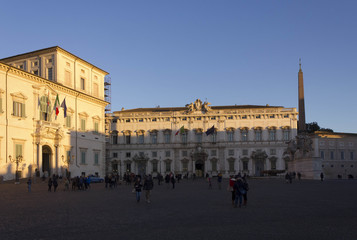 Fototapeta na wymiar Piazza Montecitorio in Rome, view of Quirinal Palace, Palazzao della Consulta and obelisk with people on the square
