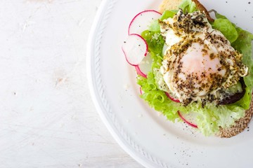 Bread with salad , vegetables and egg top view