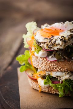 Sandwich with salad , vegetable and eggs on the wooden board