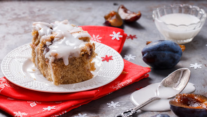 Plum cake in white icing for Christmas and New year