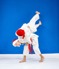 Throws Judo the athletes are train in caps of Santa Claus