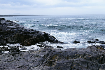 Dramatic rocky coastline leading to sea