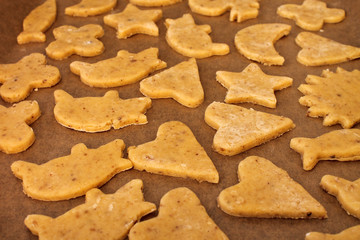 Raw christmas home-made cookies on a baking tray