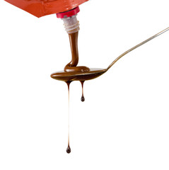 image of  liquid chocolate on a spoon closeup