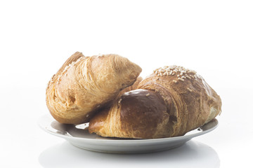 buttery croissants on a white background
