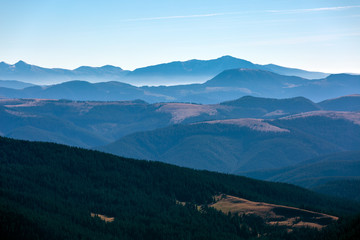 Fototapeta na wymiar Winter Mountain View with Foggy Remote Ridges