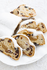 Christmas Stollen with marzipan on a plate, closeup
