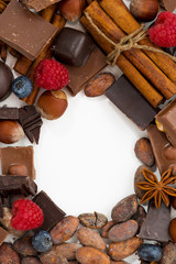 white background for text with assorted chocolate, spices