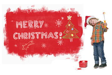 Little boy with Santa hat painting red Christmas banner on the w