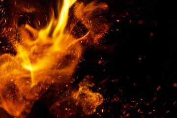 Fototapeta na wymiar fire flames with sparks on a white background