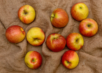 Top view of apples over sack background