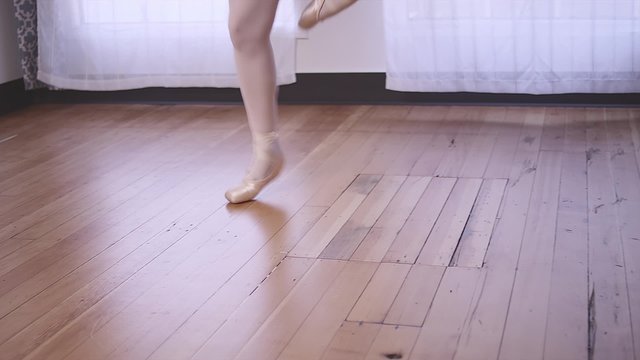 A ballet dancer practicing in a studio