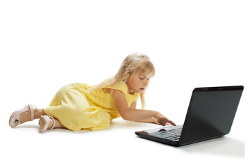 girl sits at a laptop