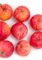red and yellow apples on a white background