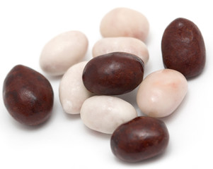 Black and white candies on a white background