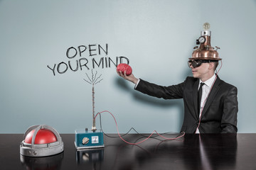 Open your mind concept with businessman holding brain